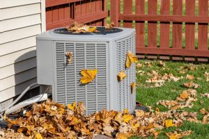 autumn-leaves-on-an-AC-outdoor-unit