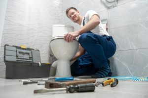 plumber-working-on-a-toilet